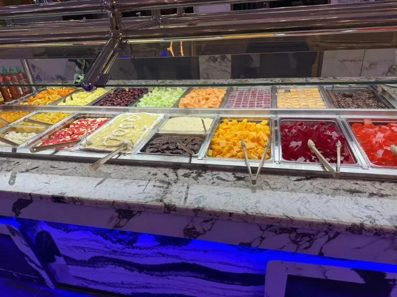 Dessert and fruit bar with cakes, jellies, and fresh fruits at King Buffet, a Buffet Restaurant in Westminster.